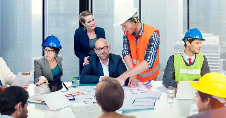 Group of executives and worker around table