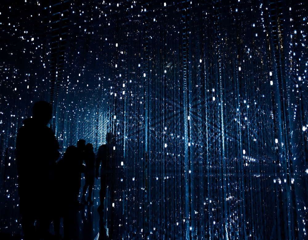 Image concept with a blue background including digital people and data representation