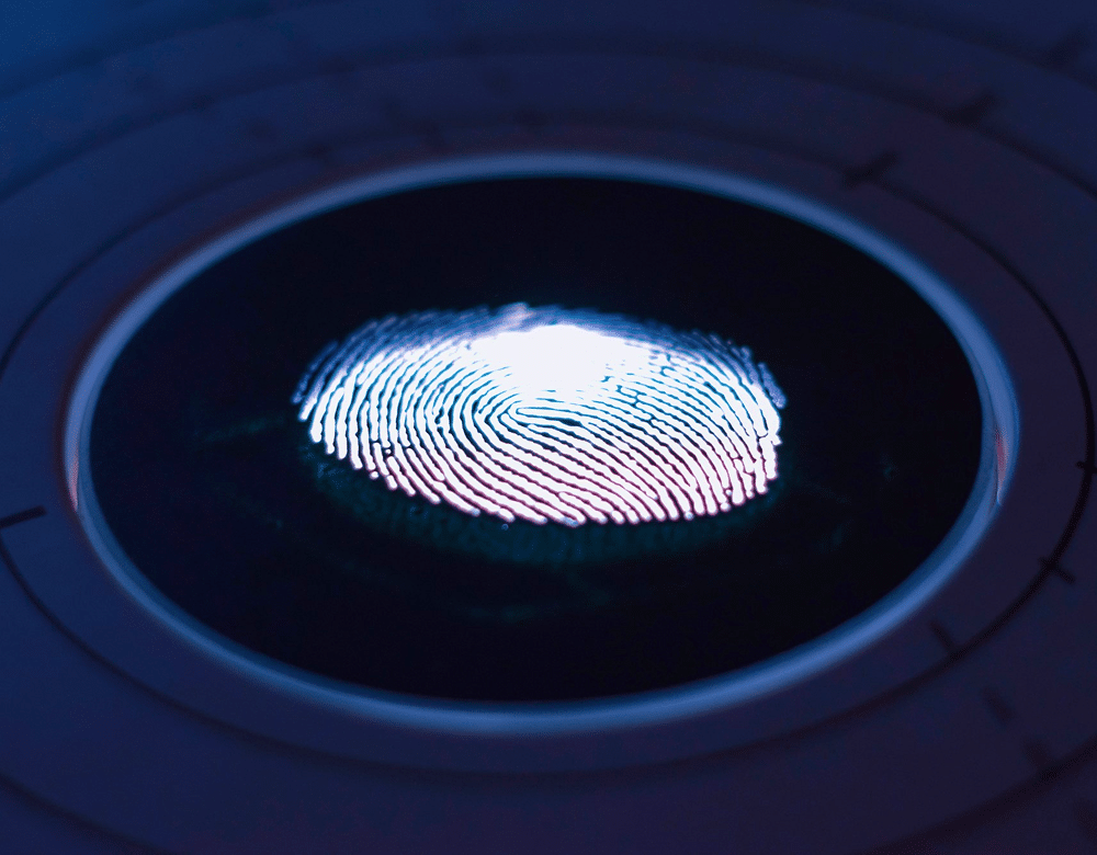 Close up of a thumb print on a digital device