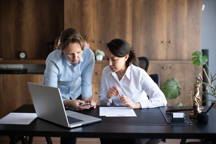 Female legal advisor lawyer helping her client with her legal issues in the office